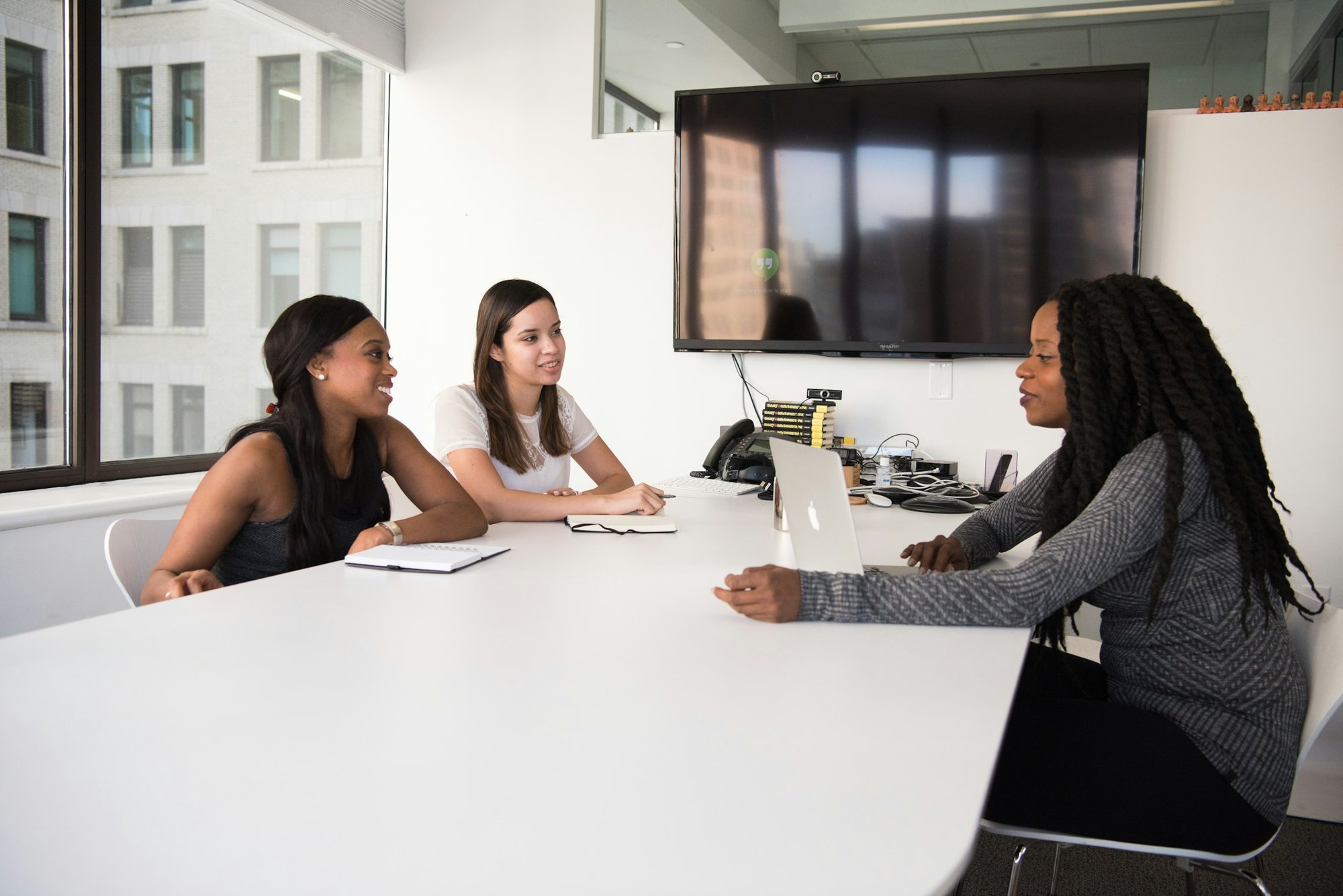 A small team meeting around a conference table