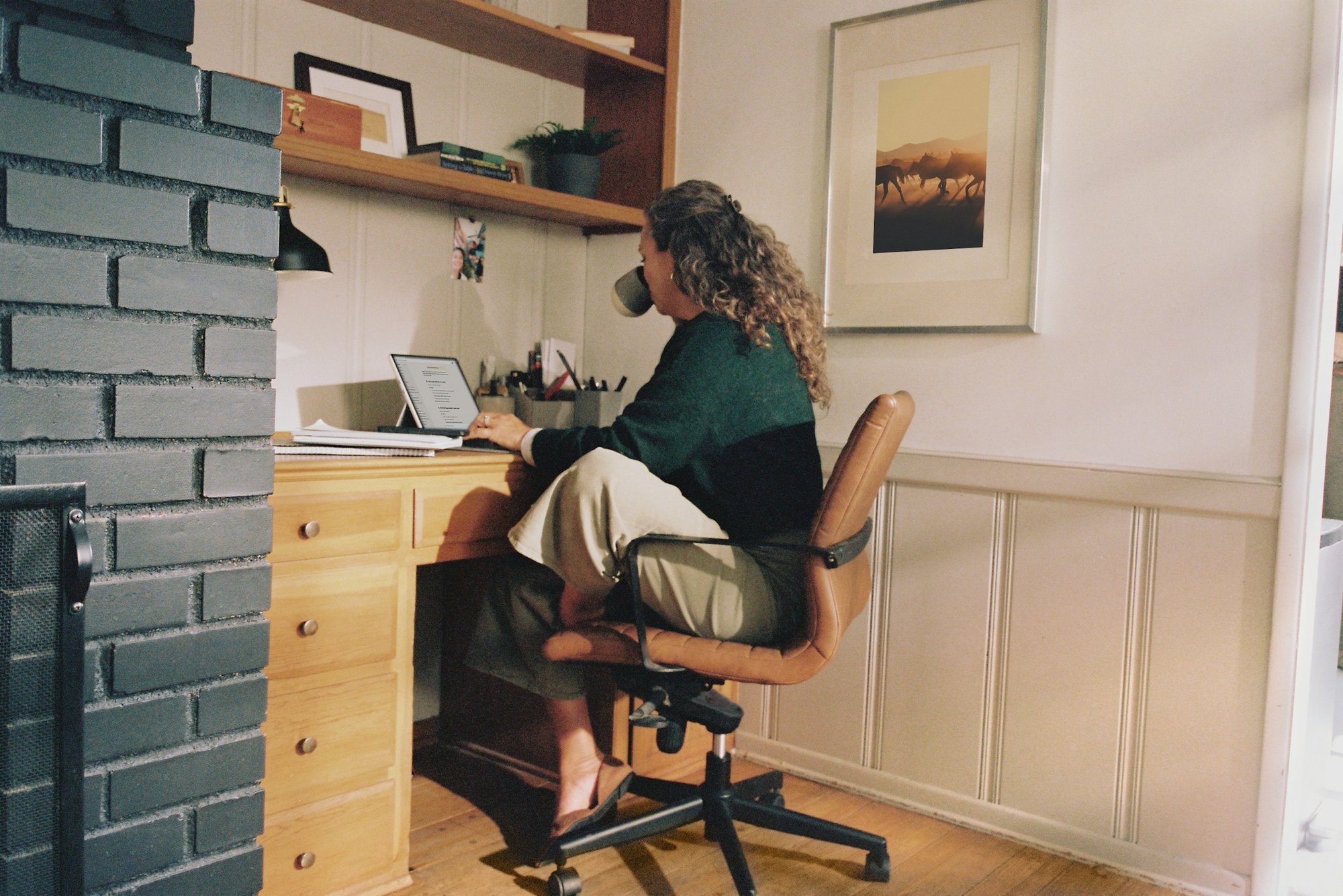 Someone working from a home office desk