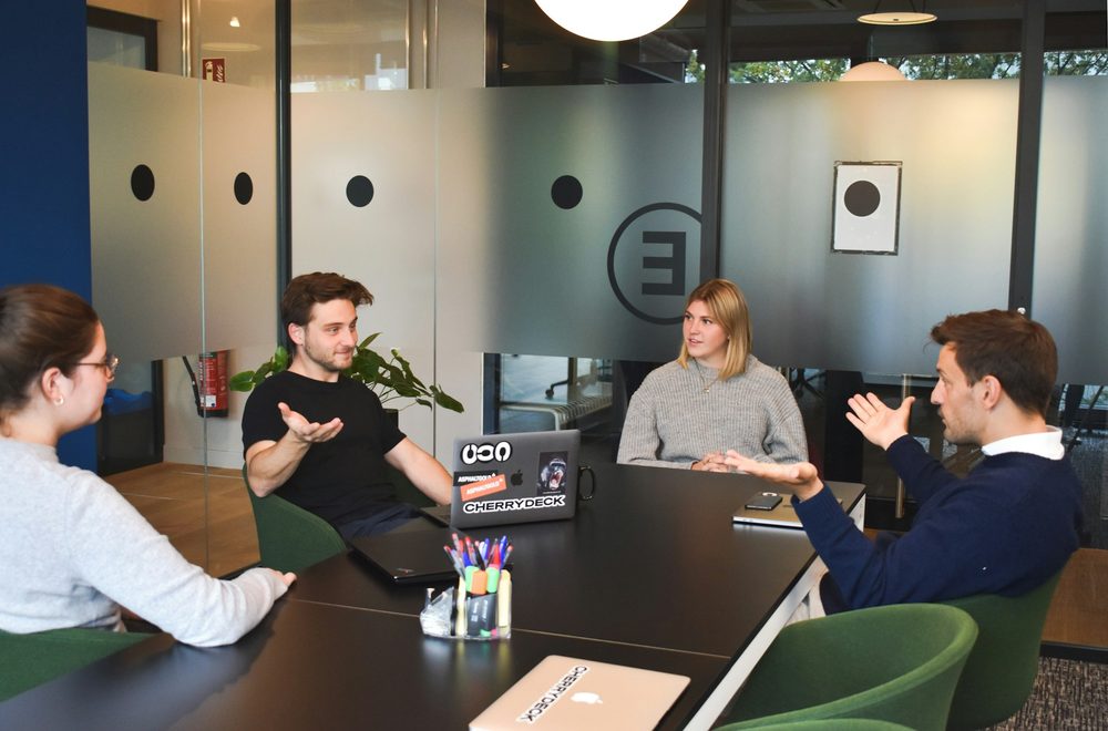 An IT team meeting around a table